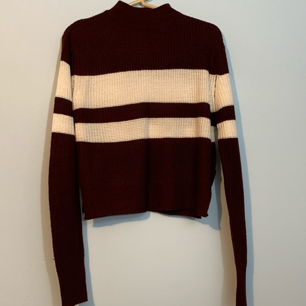 Maroon and white high neck sweater.